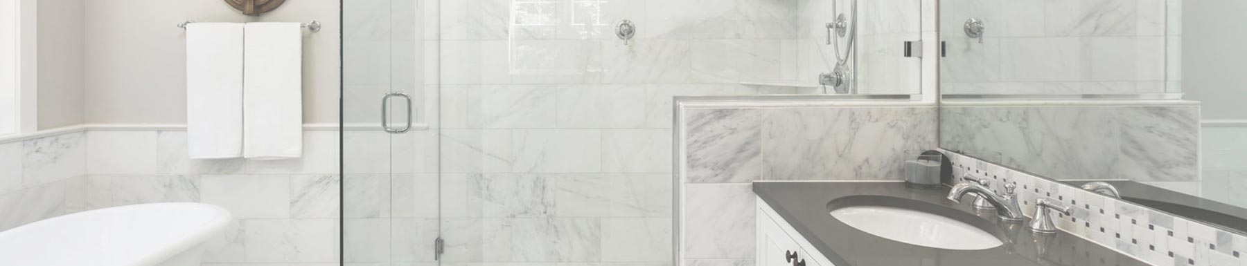 Bathroom with marble style tiles.